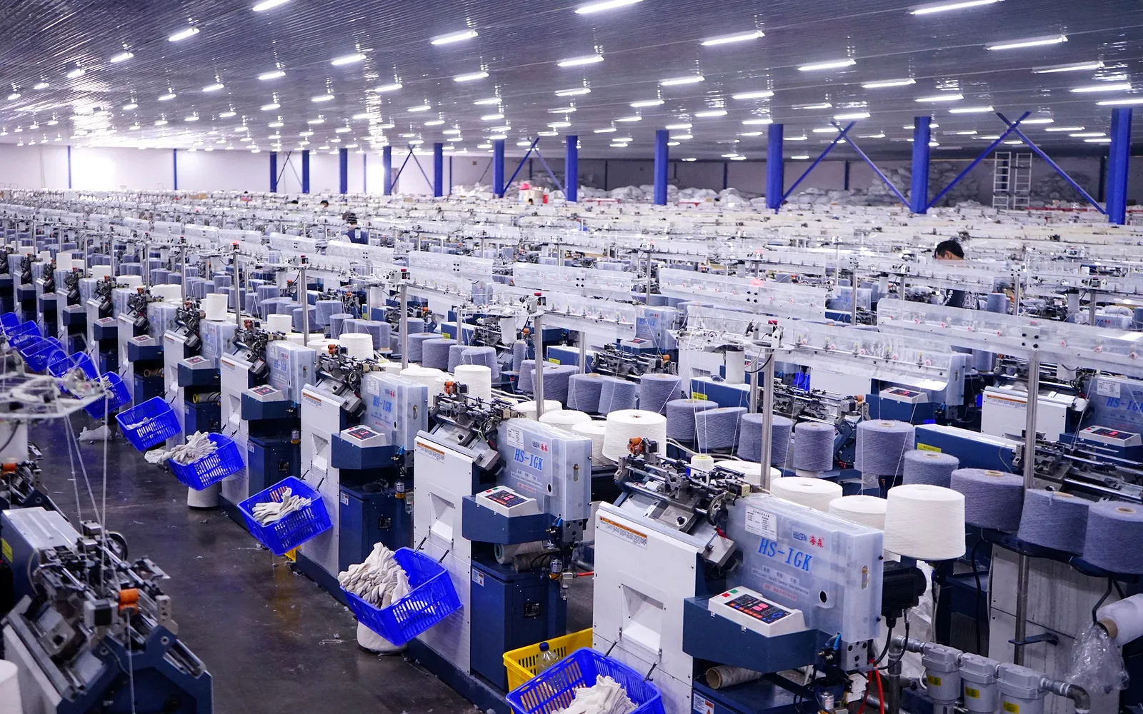 Modern glove knitting machines on the bright Mitra Saruta production floor